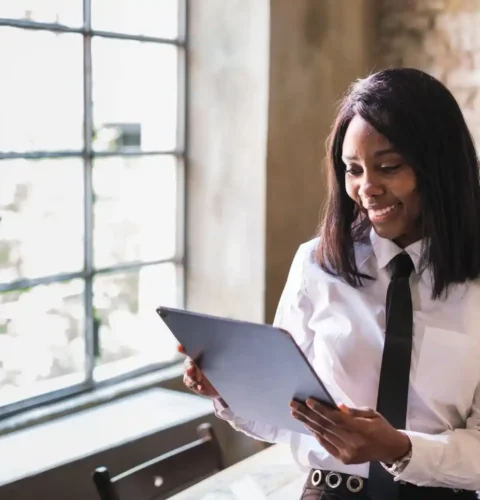young-woman-in-shirt-and-tie-working-on-her-tablet-2025-01-09-05-41-16-utc (2) (2)